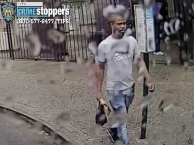 suspect wearing gray shirt and blue jeans who allegedly attacked a man on a Brookylyn bus